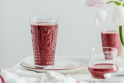 Red smoothie in a pretty glass