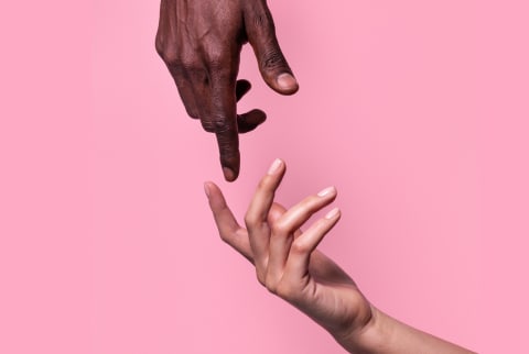 Opposed Hands Of African-American Man Pointing At Each Other Wit