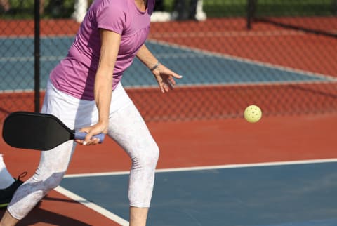 woman playing pickleball