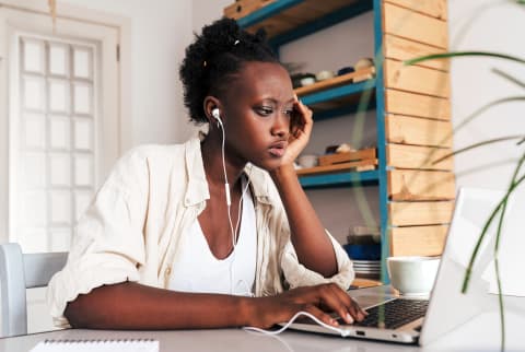 woman looking distressed at computer