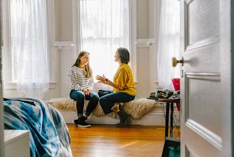 Mother and Daughter Talking in home Mother and Daughter Talking in home