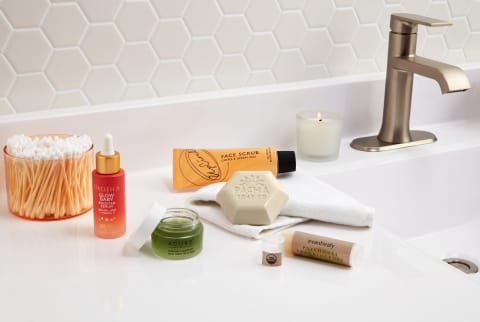 skin care products on bathroom sink