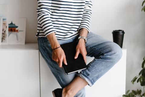 Woman Holding a Journal