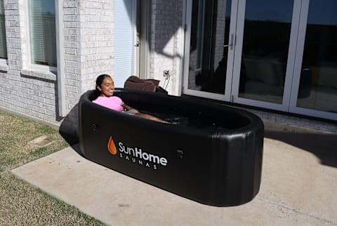 Sun Home Sauna Setup with reviewer in tub Sun Home Sauna Setup with reviewer in tub