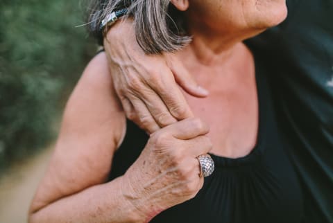 Close up of older couple holding hands