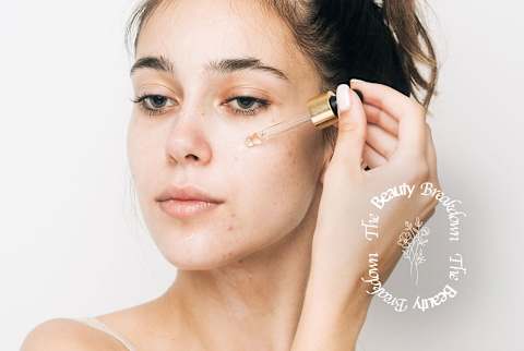 beauty breakdown, woman applying serum to face beauty breakdown, woman applying serum to face
