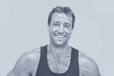 Man smiling wearing black tank top with a blue overlay