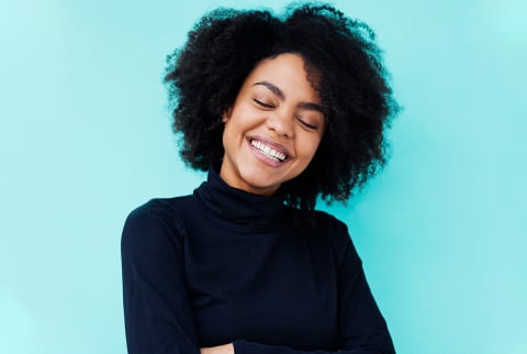 Woman smiling on blue background