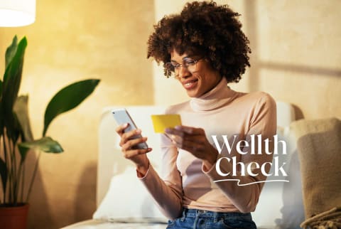 Wellth Check: Someone checking their credit score online