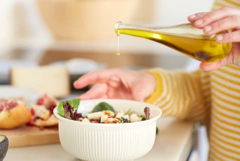 Olive Oil Over a Salad Bowl