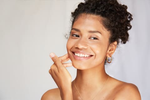 Smiling woman with glowing skin