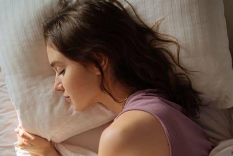 Tender Woman Sleeping In Bed