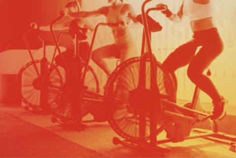 women on spin bikes with overlay