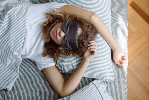 woman sleeping with eye mask