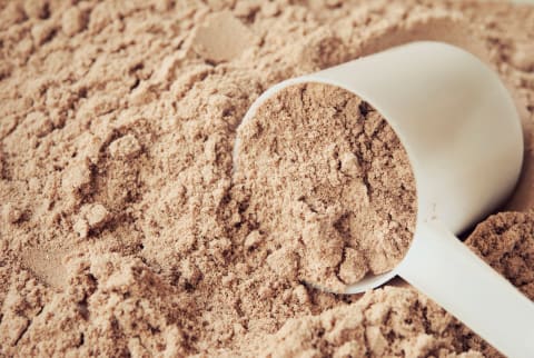 chocolate protein powder and scoop