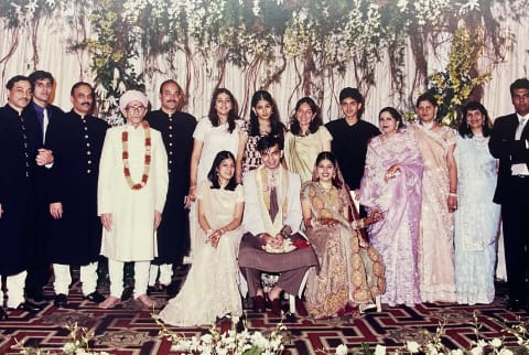 family gathered at traditional Indian wedding ceremony