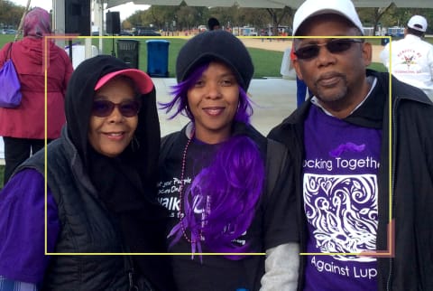 family in purple t shirts at sports match
