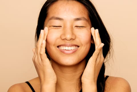 woman massaging skin