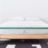 white mattress with green trim