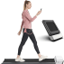 woman walking on compact treadmill