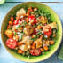 Dish with salad tomatoes arugual artichokes