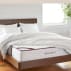 awara sleep mattress on bedframe with blankets