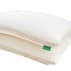 stack of two white pillows with green tags