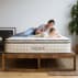 best pillow-top mattress Avocado mattress on frame with woman and child