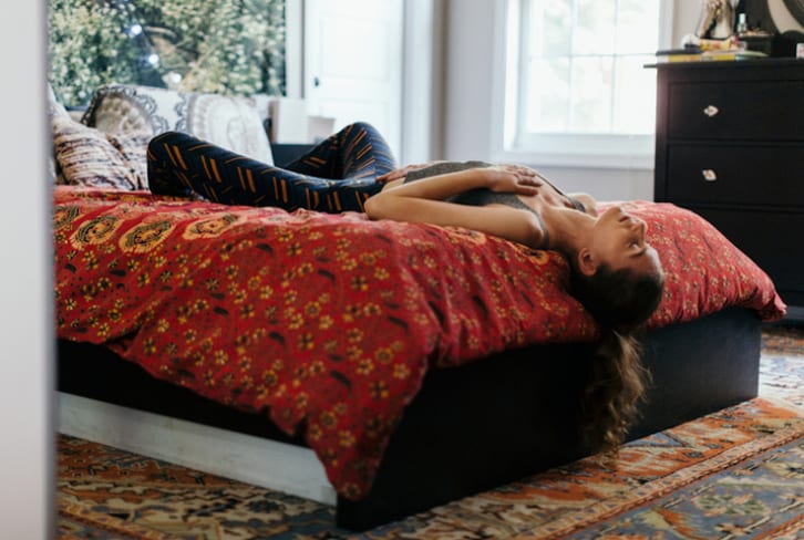 A Yoga Routine You Can Do In Bed For All-Day Energy