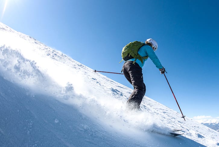 The 5 Yoga Poses You Can Do On Skis (From A Champion Skier)