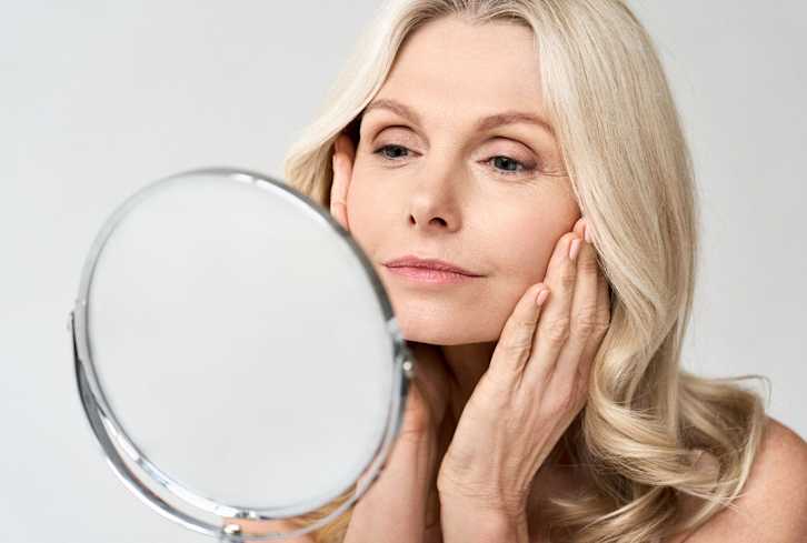 3 Reasons You Keep Waking Up With A Puffy Face (& How To Prevent It)