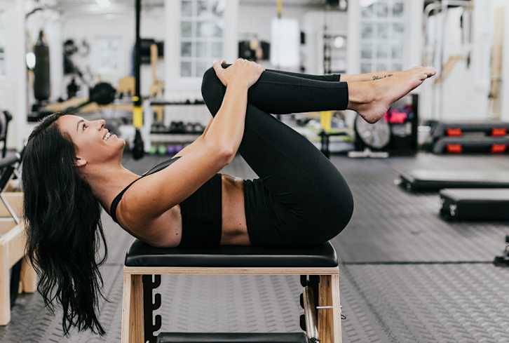 Ignite Your Core With A Pilates Move That's Way More Exciting Than Plank