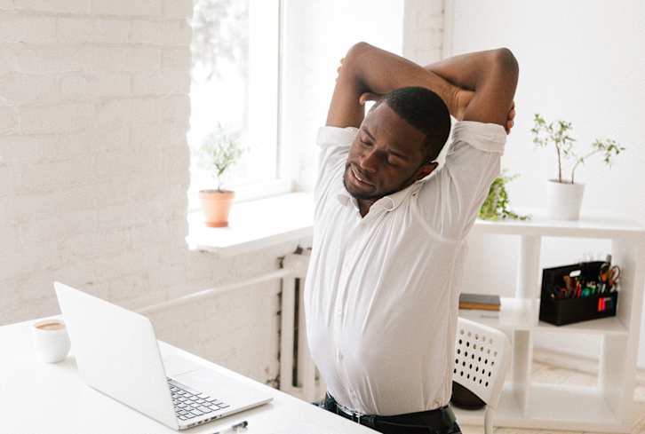 14 Stretches To Counteract The Effects Of Sitting, From A Physical Therapist