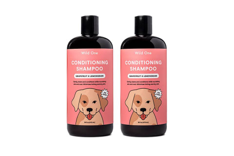 Two bottles of wild ones dog shampoo brown with a pink label