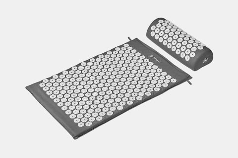 grey acupressure mat and pillow