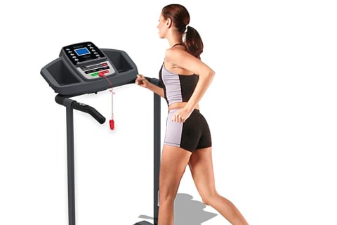 woman running on compact treadmill