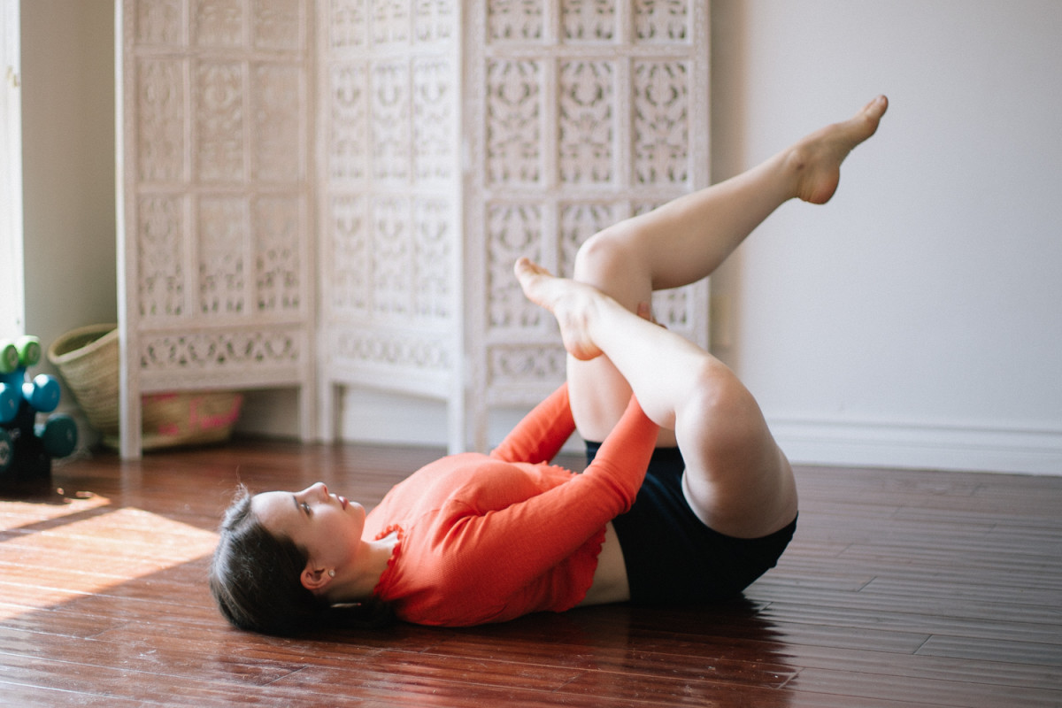 Woman Practicing Advanced Yoga Pose by Stocksy Contributor