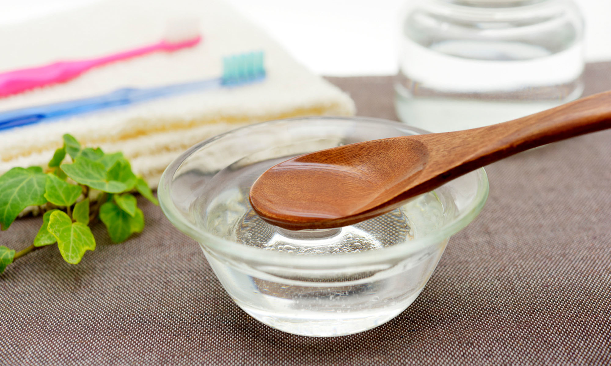 6 Benefits Of Oil Pulling + The How-To, From Dentists