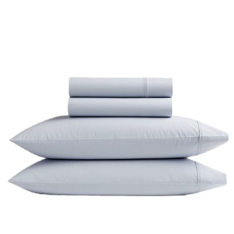 gray sky colored pillows and sheets stacked