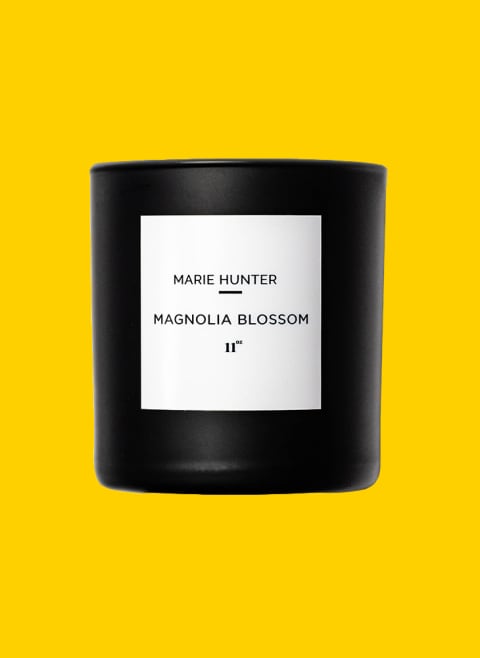 Marie Hunter Magnolia Blossom candle in black container