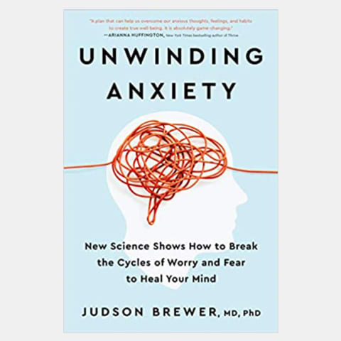 Blue book cover with the silhouette of a face and a knot representing the brain. Titled Unwinding Anxiety by Jud Brewer
