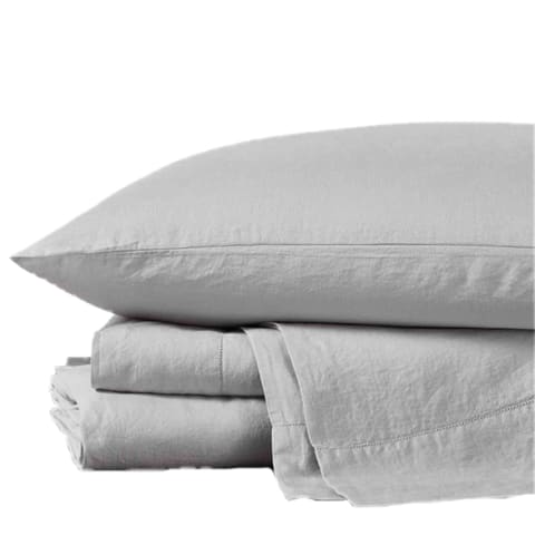 folded grey sheets with pillow