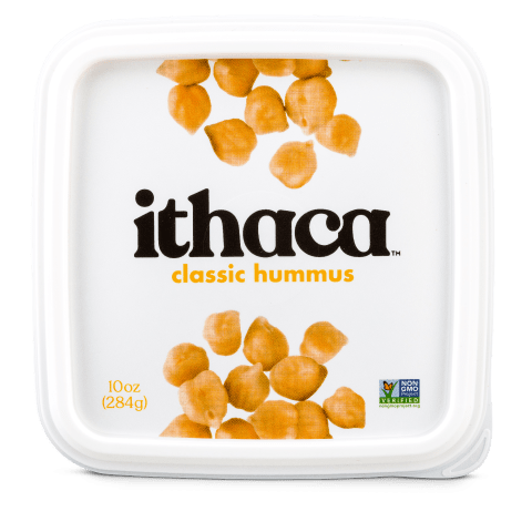 White hummus packaging with chickpeas on the lid, Ithaca written in black and classic hummus written in yellow font.