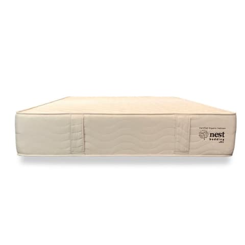 beige mattress on white background