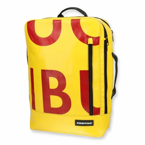 yellow backpack with red letters 