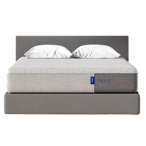 grey bed frame and mattress with white pillows