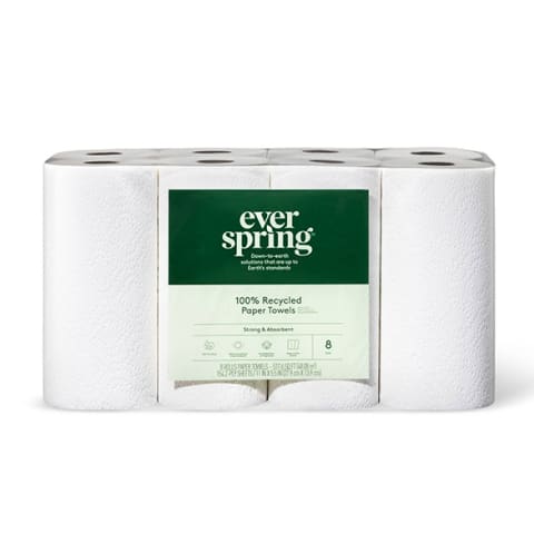 collection of white paper towel rolls with green label