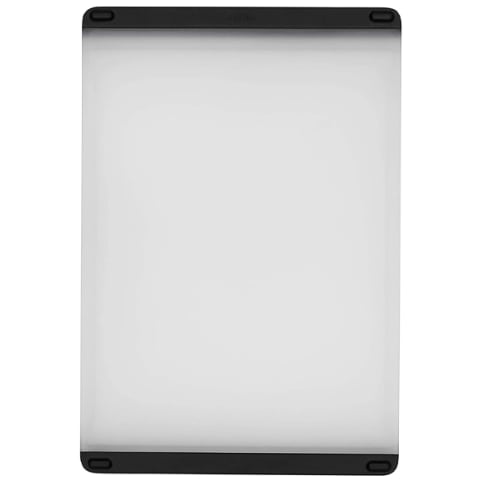 white plastic cutting board with black silicone grips