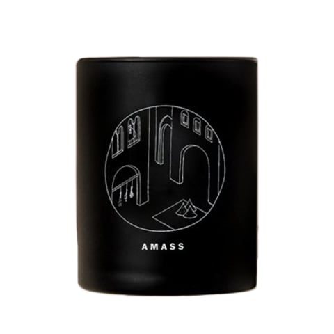 black candle with minimalist white scene