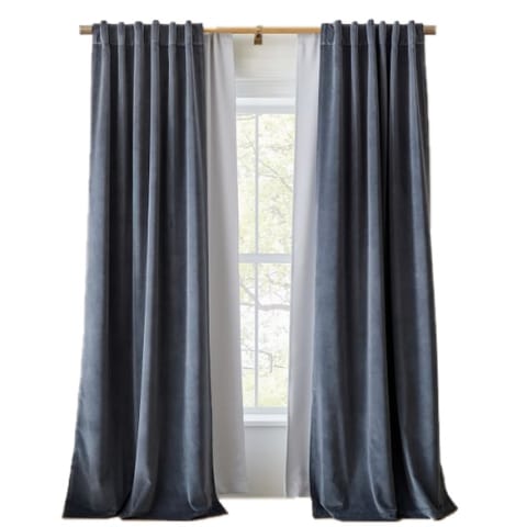 West Elm blackout curtians in blue on window